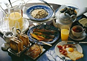 English breakfast with porridge, bacon & eggs, jam, tea