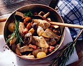 Sauteed Mushrooms in a Pan with Ham and Onions; Rosemary
