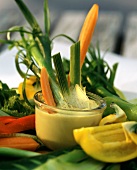 Raw Vegetable Sticks in a Bowl of Dip