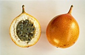 Whole and half granadillo (passion fruit)