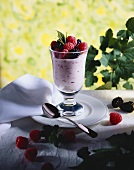 Berry cream with fresh berries in tall dessert glass