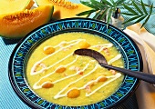 Cold melon soup with shrimps in deep plate