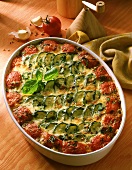 Courgette bake with tomatoes & cheese in baking dish