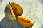 A charentais melon, cut into