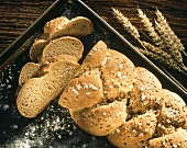 Caraway bread (bread plait with caraway & salt) on baking sheet