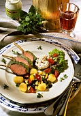 Lamb chops with herb coating, with gnocchi, peppers & olives