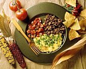 Mexican scrambled egg, mince & tomato salad on plate