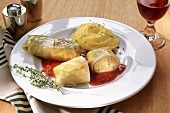 Cabbage roulade with mashed potato and red sauce