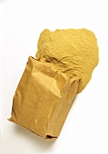 Healing earth (naturally pure loess) spilling out of paper bag