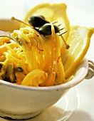 A Bowl of Saffron Spaghetti with Capers and Green Olives
