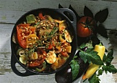 Ratatouille with sunflower seeds in pot, décor: vegetables