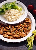 Turkey ragout with celery and tomato sauce, rice and salad