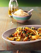 Tagliatelle with red lentils, vegetables and capers