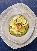 Marinated courgette slices with sesame on plate