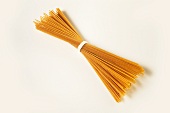 A bundle of wholemeal spaghetti (tied together with string)