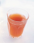 A glass of pink grapefruit juice