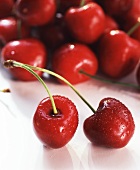 A pair of cherries, many cherries behind