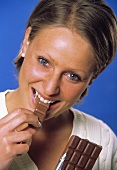 A Woman Eating a Chocolate Bar