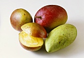 Four different ripe mangoes