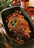 Haunch of venison & bacon in roasting tin;cranberry sauce; wine