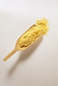 Soya flour on wooden scoop