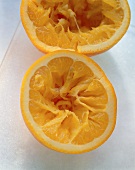 Two squeezed orange halves