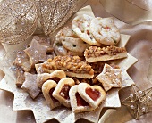 Various Christmas biscuits on gold star plate