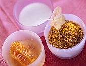 Honey, milk and pollen in bowl