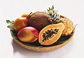 Various exotic fruits with coconut in basket