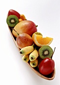Various exotic fruits in wooden bowl