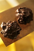 Two pralines with nuts and chocolate