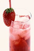 Strawberry juice in a glass with ice cubes