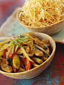 Roasted vegetables with chicken and fried noodles