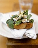 Toasted baguette slice topped with leek & goat's cheese