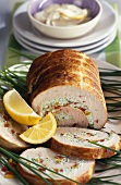 Turkey roll with pepper & cream cheese stuffing, cut into