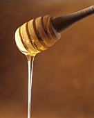 Honey running from a honey spoon