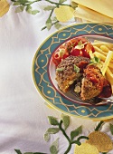 Stuffed frikadeller with chips and tomato salad