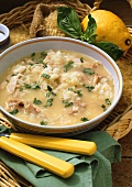 Creamy chicken soup with rice and basil