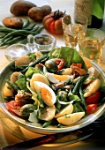 Mixed vegetable salad with egg, tuna & salami