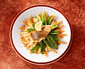 Fried red perch fillet with mangetouts and carrots
