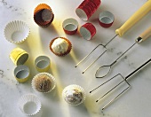 Various chocolates, with utensils for making them
