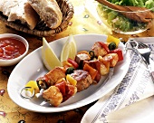 Poultry & meat kebabs with vegetables, white bread & salad