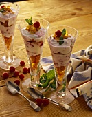 Raspberry quark with cornflakes in tall glasses