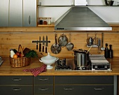 View of a kitchen with various kitchen utensils