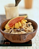 Rice pudding with bananas, mango, papaya and raisins