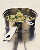 Spinach risotto in pan