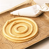 Choux pastry rings on sweet pastry base