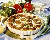 Potato bake with meatballs and spring onions