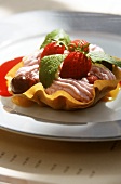 Strawberry mousse with fresh berries in wafer bowl