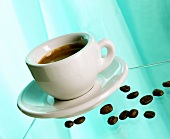 Cup of coffee and coffee beans